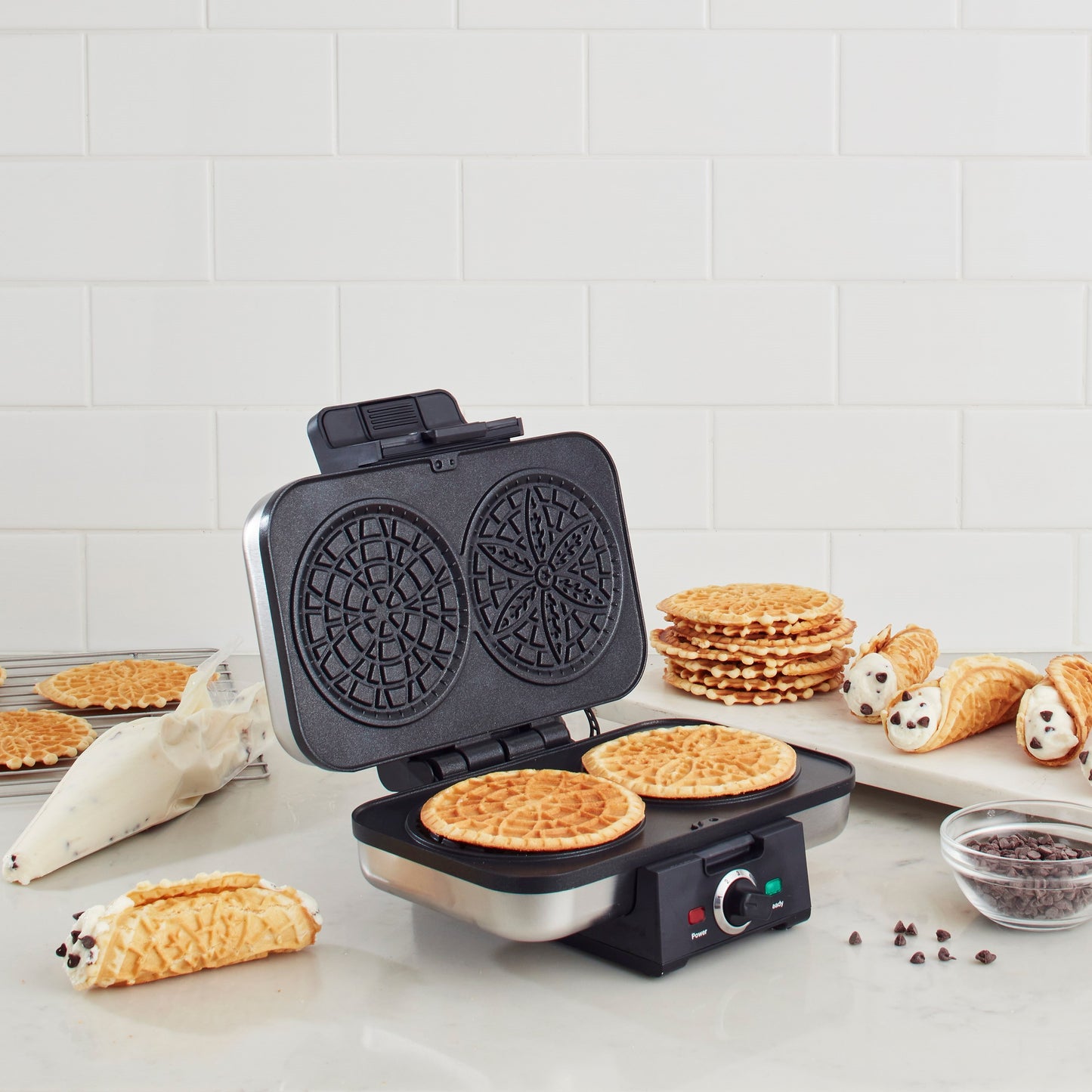 Cuisinart simplifies the art of making the perfect pizzelle. Our Pizzelle Press bakes two, thin, 4-inch Italian waffle cookies at once. Five browning shades let users make pizzelle dark or light, hard and crisp, or soft and chewy. Indicator lights guarant